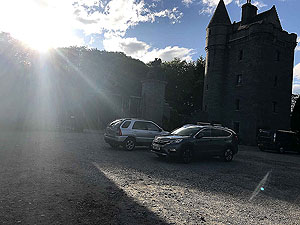 Loch Skene . Sunhine over the estate gates