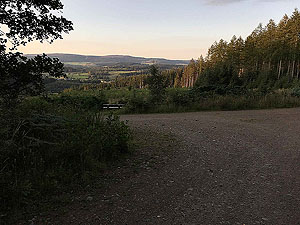 Scolty hill and more. As the sun starts to go down, there's a wee bench to take it all in