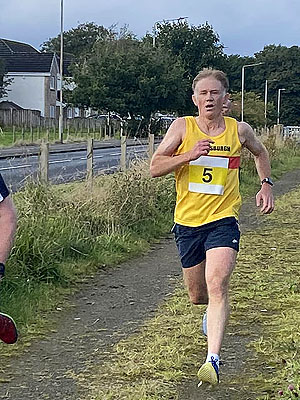 Trident 10K : HAAC runner at finish line