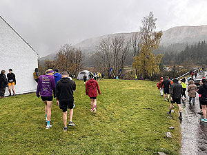 Bridge of Orchy 10k  : Runners in the rain going to the start line